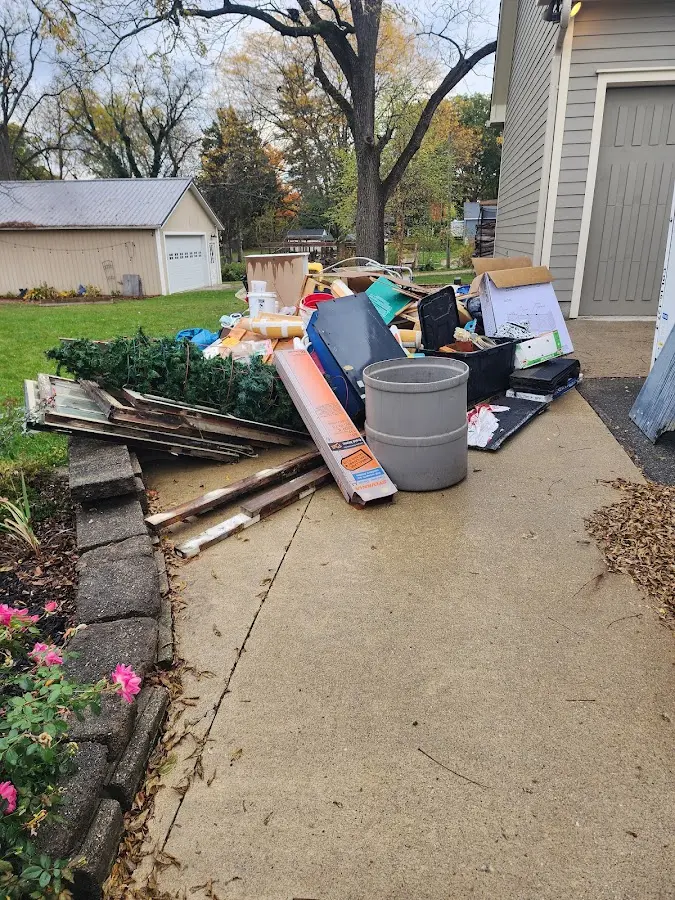Dumpster being loaded with debris for Residential Dumpster Rental in West Plains